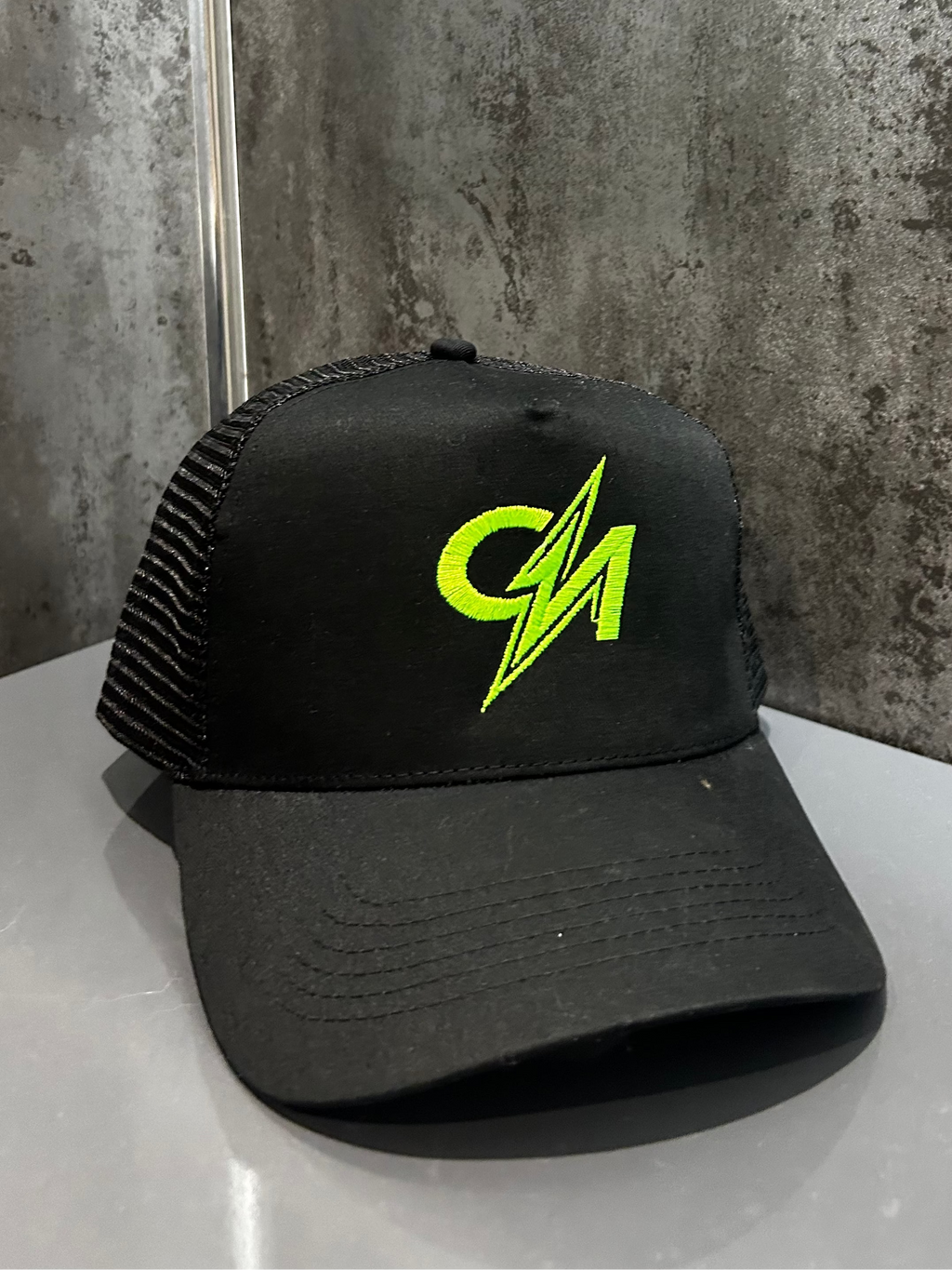 The Neon Green Trucker Hat is built to stand out. Lightweight with a breathable mesh back and adjustable snapback, it’s made for all-day comfort. Bold, durable, and impossible to ignore.